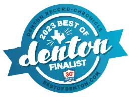 Blue circular badge with white text reading “2023 Best of Denton Finalist” and “Denton Record-Chronicle.” It features a Texas outline with a star and the website bestofdenton.com at the bottom.